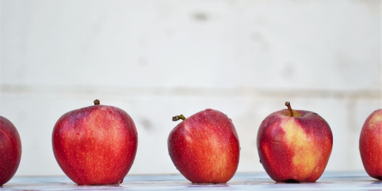 image of line of not perfect apples representing imperfection